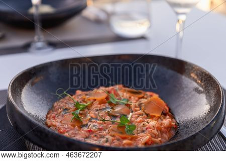 Seafood Giouvetsi (yiouvetsi) In Modern Style- Greek Dish With Small Noodles And Tomato Sauce