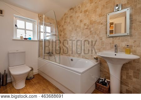 Stradishall, England - March 21 2016: Traditional Partially Tiled Bathroom