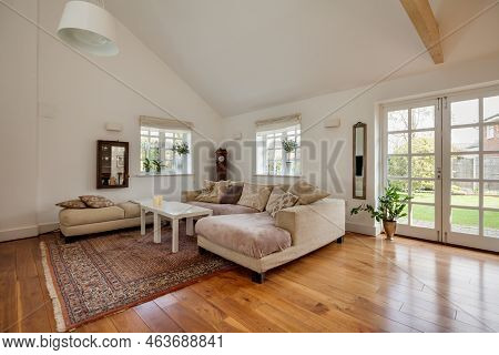 Stradishall, England - March 21 2016: Contemporary Furnished Modern Living Room With Vaulted Ceiling