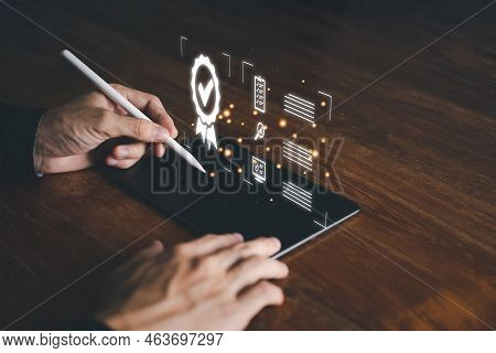 Businessman Hand Hold Smartpen And Tablet With Good Sign And Sign Of The Top Service And Correct. Is