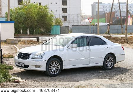 Atyrau, Kazakhstan - October 3, 2022: White Luxury Car Toyota Crown Majesta (s180) In The City Stree