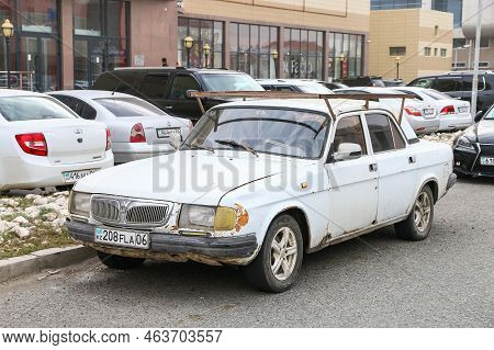 Atyrau, Kazakhstan - October 10, 2022: Old Saloon Car Gaz-3110 Volga In The City Street.