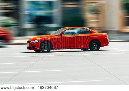 Red Car Bmw M4 F82 Is Moving Fast On The Road. Moscow, Russia - July 2022
