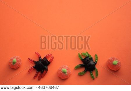 Hallowee: Jelly Candies In The Form Of Huge Black Spiders With Green And Red Legs And Pumpkins On Or