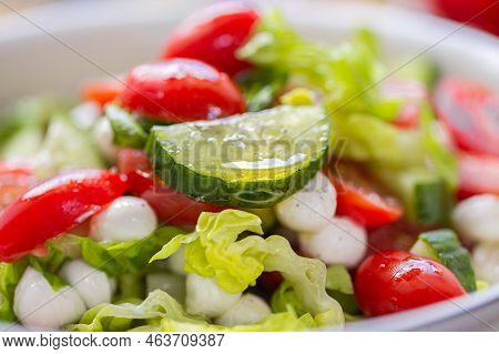 Fresh Lettuce Macro Shot. Salad With Baby Mozzarella Cherry Leaves Iceberg. Olive Oil In Salad. Sala