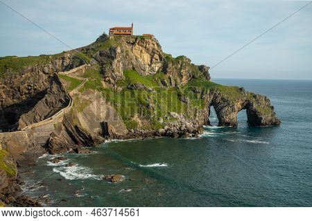 Stone Footpath To Famous Landmark And Film Location In North Of Spain, Ocean Islet With Chapel San J