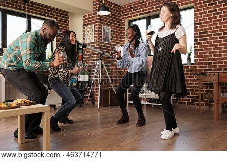 Multi Diverse Young Adults Friends, Mates, Partners Having Fun, Laughing, Smiling, Guffawing, Dancin