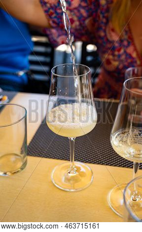 Drinking Of Txakoli Or Chacolí Slightly Sparkling Very Dry White Wine Produced In Spanish Basque Cou