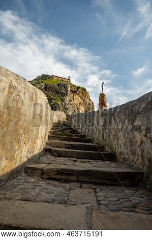 Stone Footpath To Famous Landmark And Film Location In North Of Spain, Ocean Islet With Chapel San J