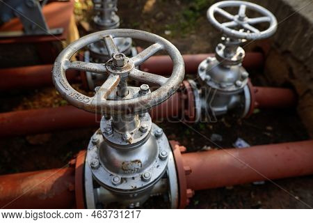 Shallow Depth Of Field (selective Focus) Details With Industrial Metallic Pipe Valves Used To Open O