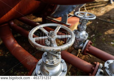 Shallow Depth Of Field (selective Focus) Details With Industrial Metallic Pipe Valves Used To Open O