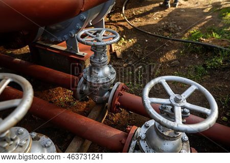 Shallow Depth Of Field (selective Focus) Details With Industrial Metallic Pipe Valves Used To Open O