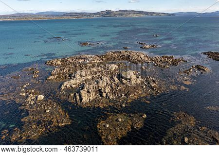Aerial View Of Rocks At Cloughcorr Beach On Arranmore Island In County Donegal, Republic Of Ireland