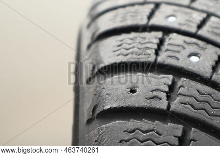 Winter Car Tire Repair. Worn Tire Tread, Winter Studded Tire - Wheel Repair Service. Renew Lost Stud