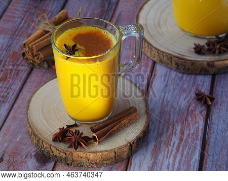 Golden Milk, Turmeric Latte. Indian Masala Haldi Doodh - Hot Healthy Drink With Turmeric Roots, Cinn