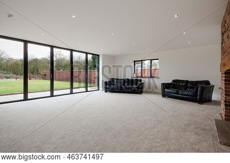 Dry Drayton, Cambridgeshire - Jan 10 2017: Contemporary New House Sitting Room Lounge With Bifold Do