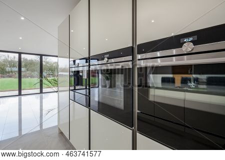 Dry Drayton, Cambridgeshire - Jan 10 2017: Contemporary Modern Kitchen Detail With Triple Ovens, Cab