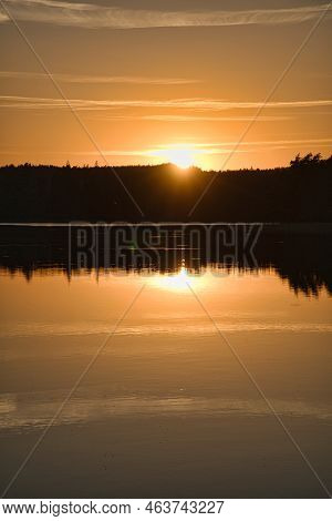 Sunset With Reflection On A Swedish Lake In Smalland. Romantic Evening Mood. Landscape Shot From Sca