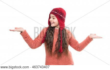 Teen Girl Model In Earflap Hat Presenting Product With Copy Space. Teen Girl In Earflap Hat