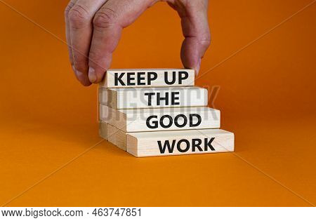 Keep Up The Good Work Symbol. Concept Words Keep Up The Good Work On Wooden Blocks. Businessman Hand