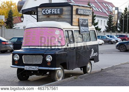 Krasnoyarsk, Russia - 24 September, 2022: Mobile Coffee Shop In Brown Nysa 522 Van On City Street.
