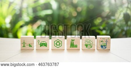 Carbon Footprint And Carbon Emission Reduction Concept Symbols Of Carbon Footprints On A Wooden Cube