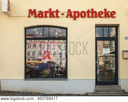 Germany, Wismar - July 13, 2022: Markt Apotheke, Market Square Pharmcy Beige Front Facade With Red W