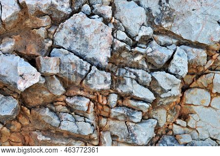 Cracked Stone Background. Close Up Of Cracked Mountain Rock
