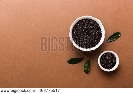 Quinoa Seeds In Bowl On Colored Background. Healthy Kinwa In Small Bowl. Healthy Superfood.