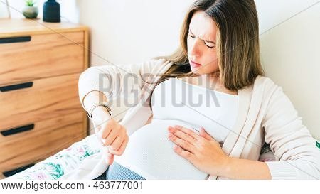 Pregnancy Contractions Time. Childbirth Time, Contractions Pain. Pregnant Holding Baby Belly, Woman 
