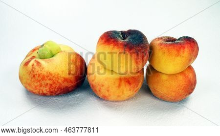 Unusual Donut Peach Isolated On White. Ripe Fresh Tasty Flat Peaches Of Unusual Shape, Fused Two By 