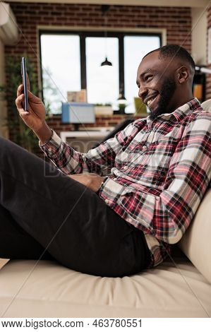 Young Adult Using Online Smartphone Videocall To Talk To People On Videoconference Chat. Working Fro