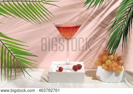 Modern Still Life With Alcoholic Margarita Cocktail And Grapes On Pastel Background With Long Hard S
