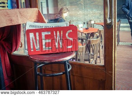 Bologna, Italy - April 3, 2018: Scenes From An Italian Cafe. A Corriere Della Sera Newspaper Is Free
