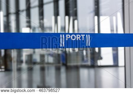 Blue Barrier Belt In A Port. Queue Pole
