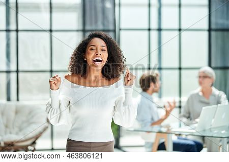 Happy Business Woman Standing In The Office .
