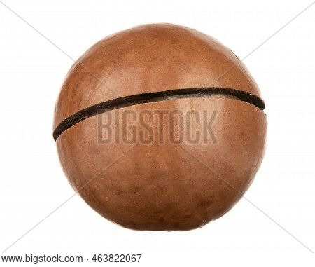 Macroshot Of A Macadamia Nut With A Cut On The Shell Isolated On A White Background. Copy Space.