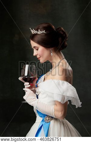 Aroma And Flavor. Young Elegant Woman In Image Of Princess Or Viscountess Tasting Red Wine Isolated 