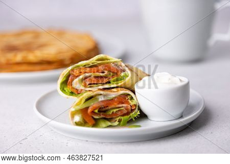Pancakes With Salmon (trout), Sour Cream And Greenstuff. Thin, Not Sweet Blinchiki Stuffed With Red 