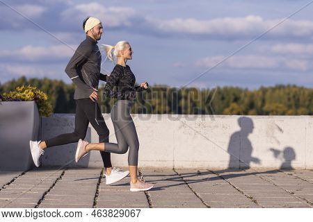 Two Positive Caucasian Runners Athletes Training Together During Running Training Fitness Exercise A