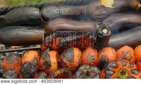 Close-up Of Vegetables On Skewers Roasting On The Grill. Top View. Delicious And Healthy Food. A Tra
