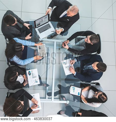 Business Team Using A Laptop To Analyze Financial Data