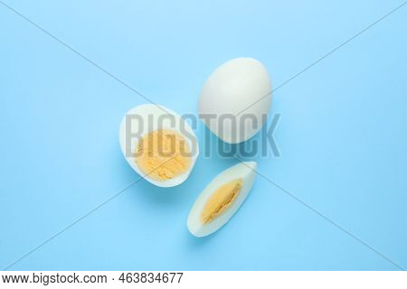 Fresh Hard Boiled Eggs On Light Blue Background, Flat Lay