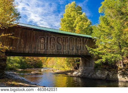 Side View Of Montgomery Covered Bridge Near Waterville In Vermont During The Fall