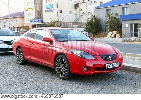 Atyrau, Kazakhstan - October 19, 2022: Red Coupe Car Toyota Camry Solara In The City Street.