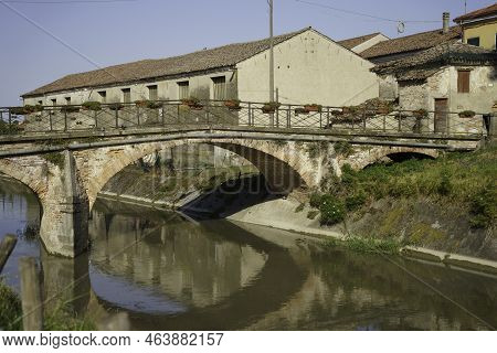 Old Buildings Along A Canal Near Badia Polesine, In Rovigo Province, Veneto, Italy