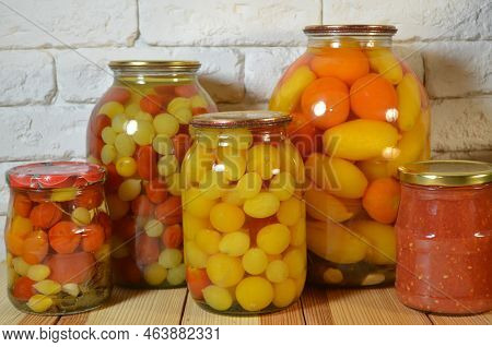 Tomatoes In A Jar. Red, Yellow Orange Fruits. Pickles. Proper Nutrition.