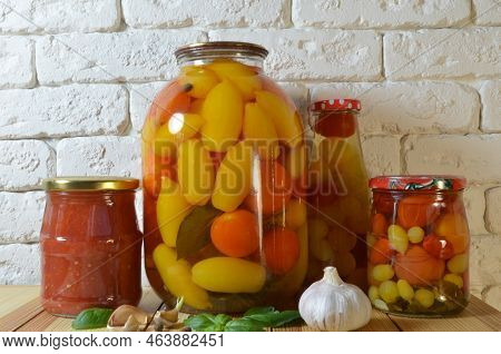 Tomatoes In A Jar. Red, Yellow Orange Fruits. Pickles. Proper Nutrition