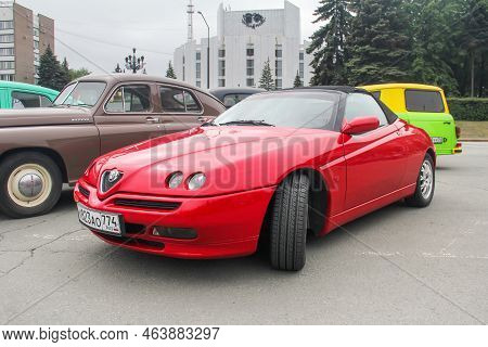 Chelyabinsk, Russia - June 13, 2022: Red Sports Car Alfa Romeo Spider (type 916) Takes Part In The T