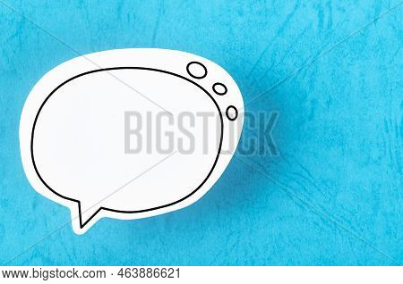 Speech Bubble With Copy Space Communication Talking Speaking Concepts On Blue Background.